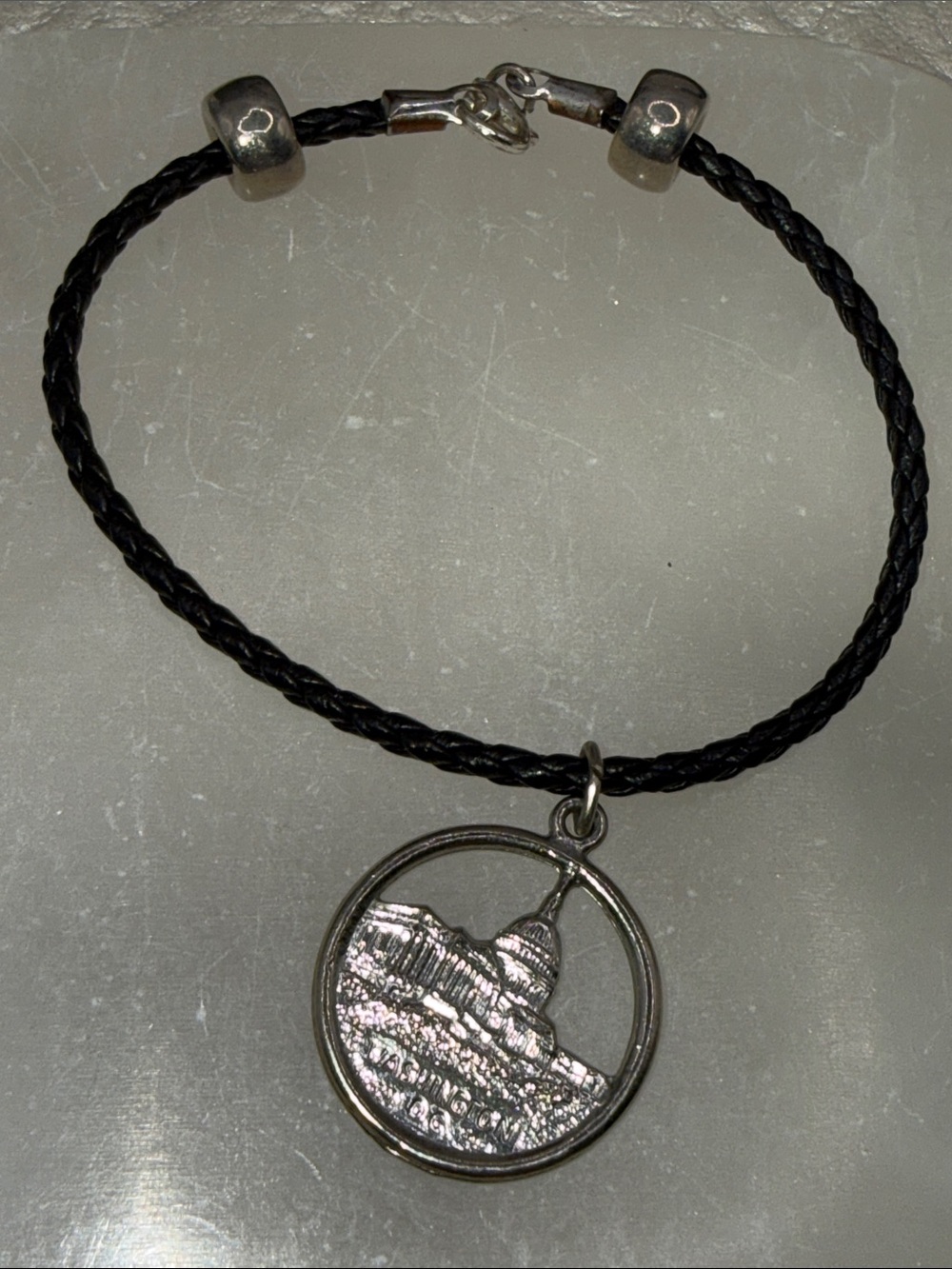 Silver-tone Dome Charm Black Braided bracelet Washington DC distressed piece